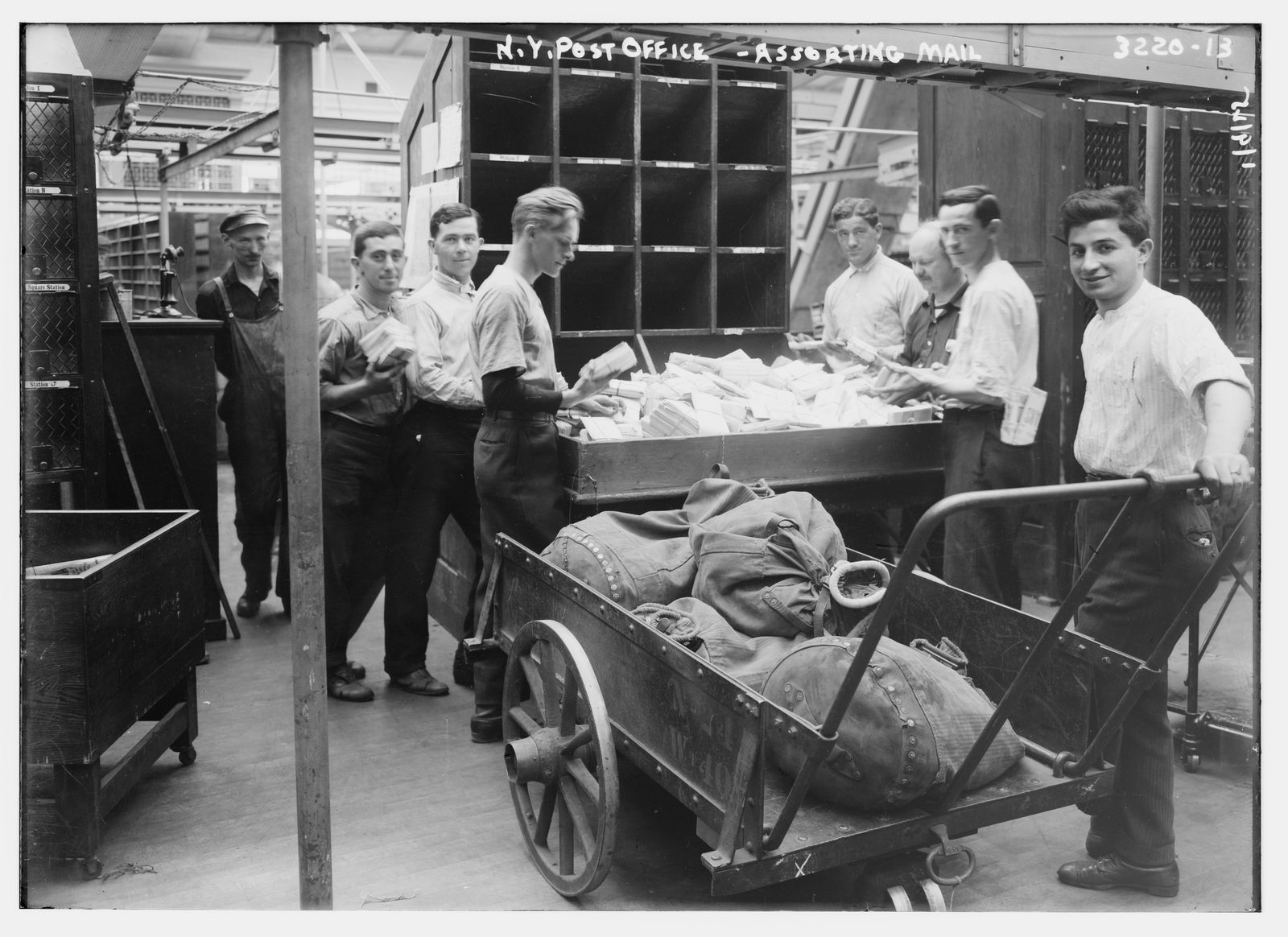 Postal workers sorting mail at a New York post office, 1914